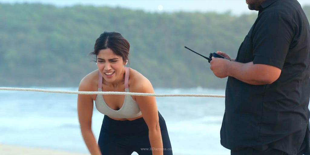 Bhumi Pednekar posing confidently on the set of Netflix series The Royals wearing a chic black sports bra and athletic wear.