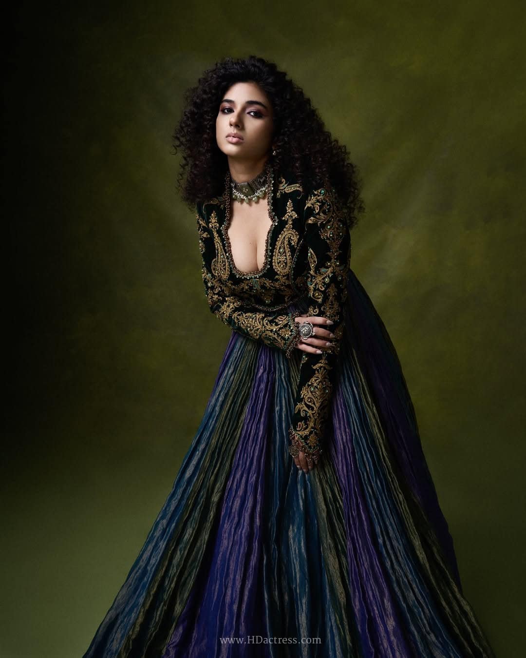 South Indian actress Pragya Nagra posing confidently in a glamorous dress with a daring deep-cut cleavage neckline during a viral fashion photoshoot.
