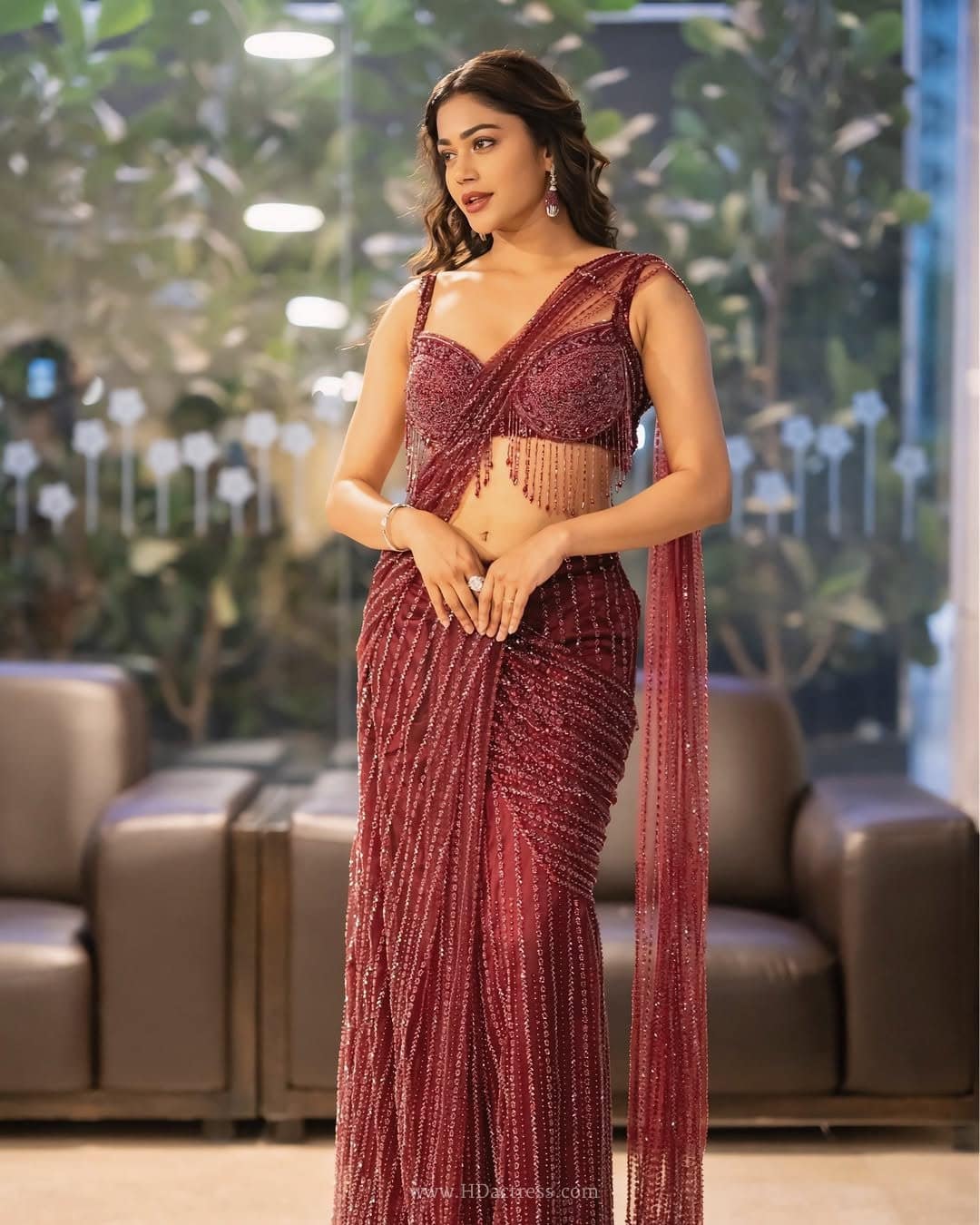 Payal Radhakrishna posing confidently in a modern maroon Indo-western Backless & Low-Waist lehenga