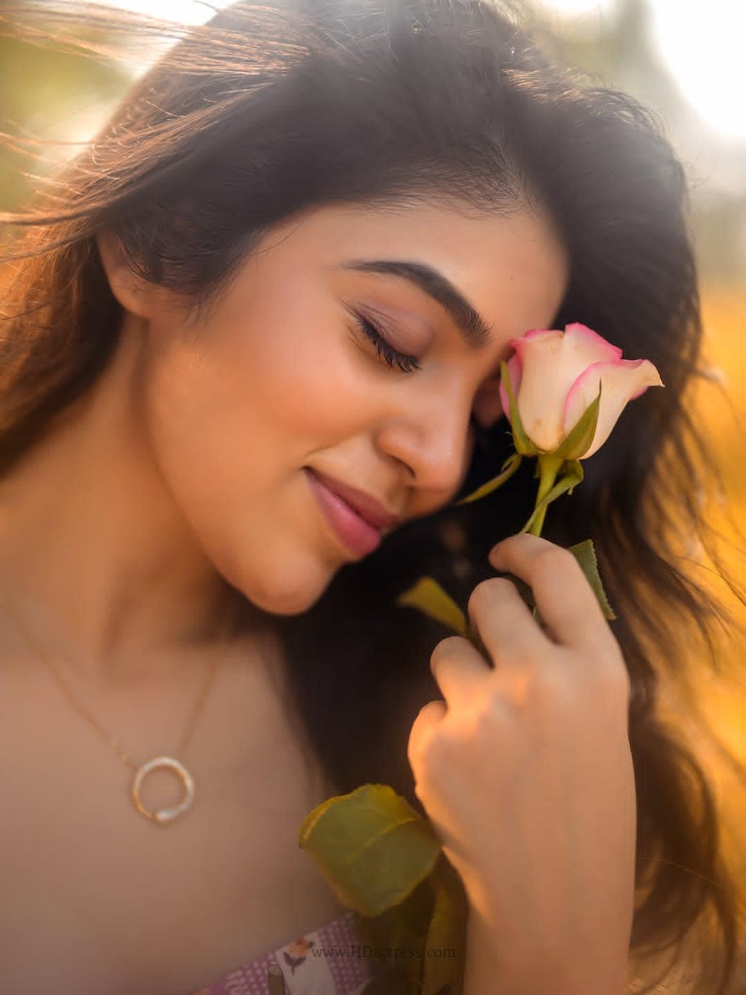Masooda movie fame Bandhavi Sridhar smiling during a professional lifestyle outdoor photoshoot under soft golden light.