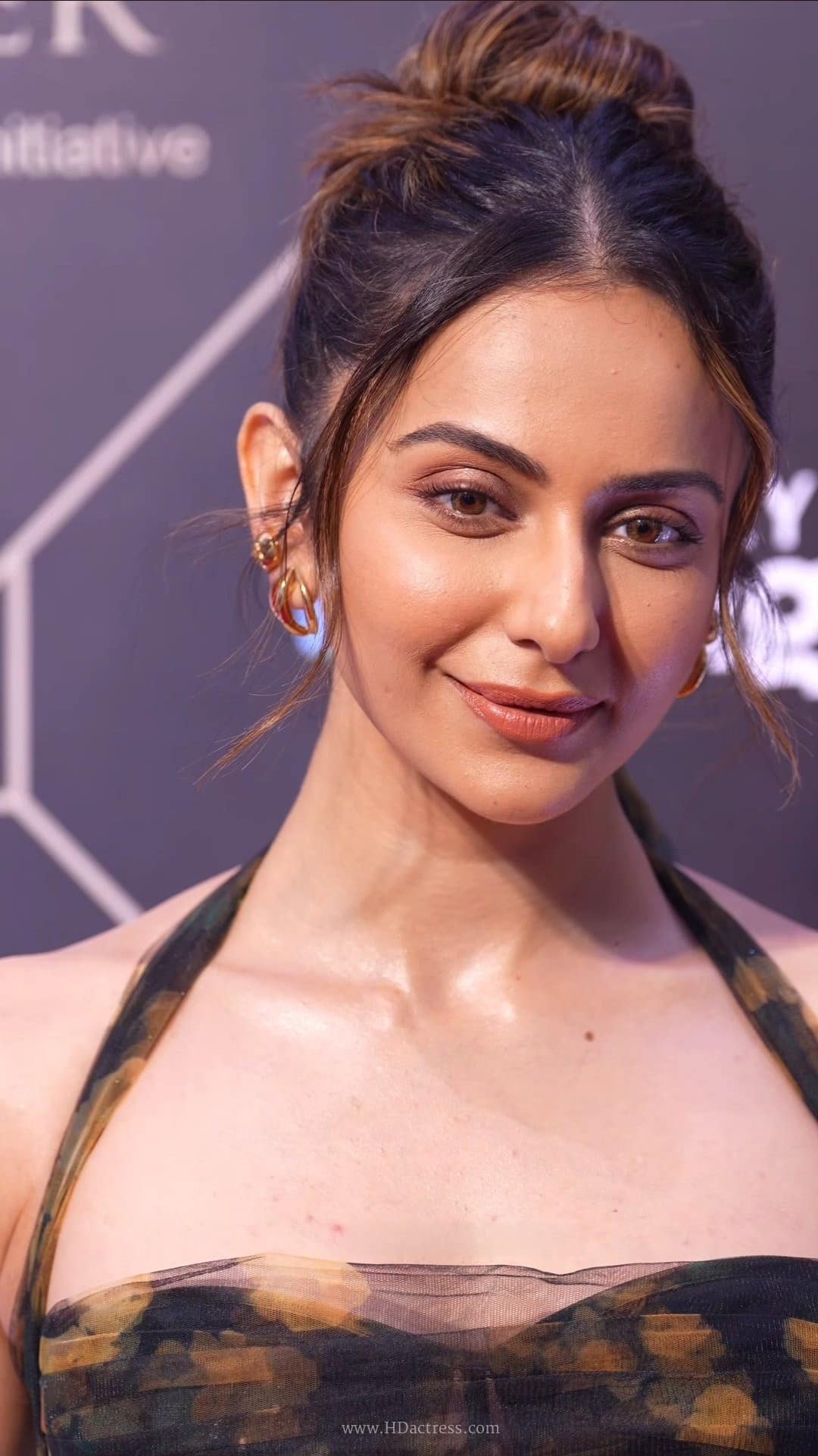 Rakul Preet Singh close-up portrait showing her striking facial features and elegant styling.