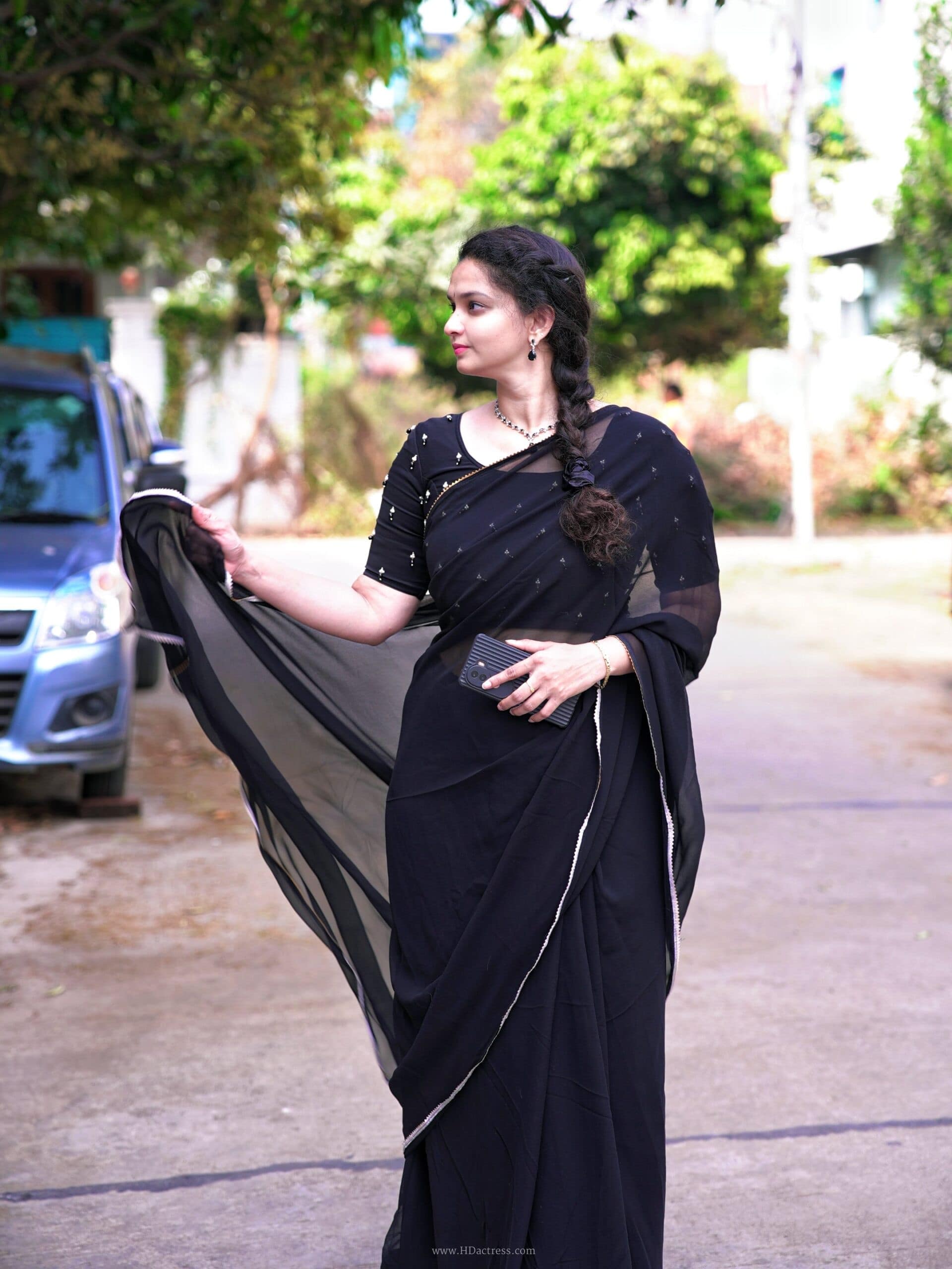 suma kancharla, sumiitalks, alekhya chitti pickles, black transparent saree, voluptuous curves, saree photoshoot, viral photos, ethnic wear trends, celebrity style, see-through saree, glamorous look, modern saree drapes