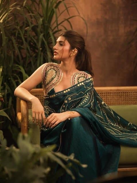 th portrait of Sree Leela flaunting her curves in an elegant designer saree with heavy embroidery.