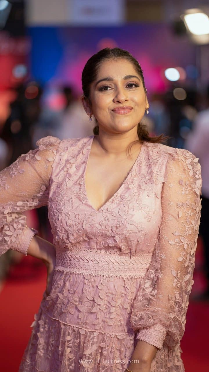 Close-up shot of actress Rashmi Gautam flaunting her gorgeous curves on the red carpet.